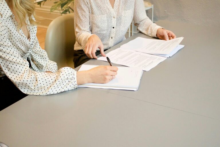 Legal consultation at Marshiano Law Group - expert attorneys reviewing legal documents for clients.