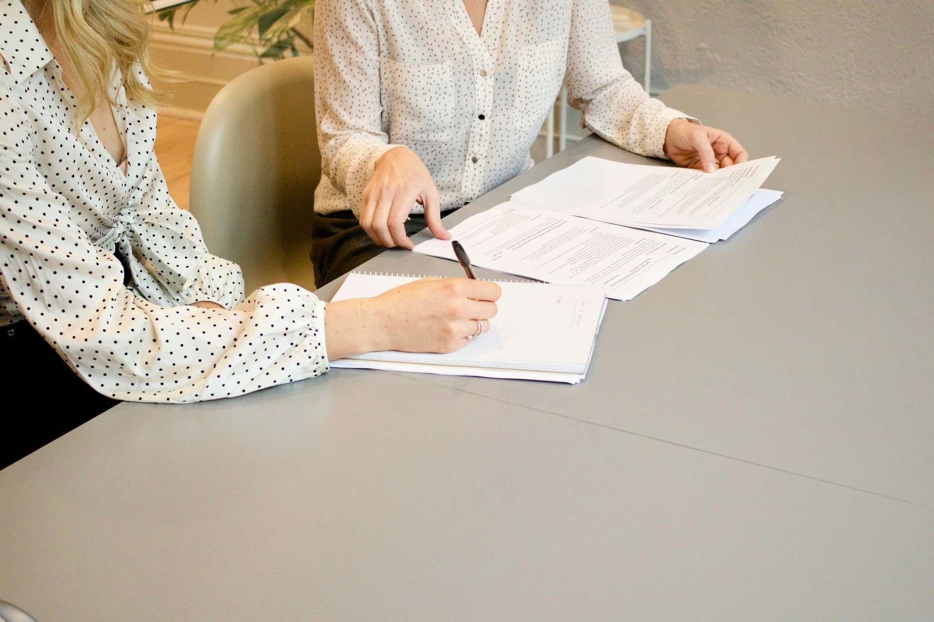 Legal consultation at Marshiano Law Group - expert attorneys reviewing legal documents for clients.